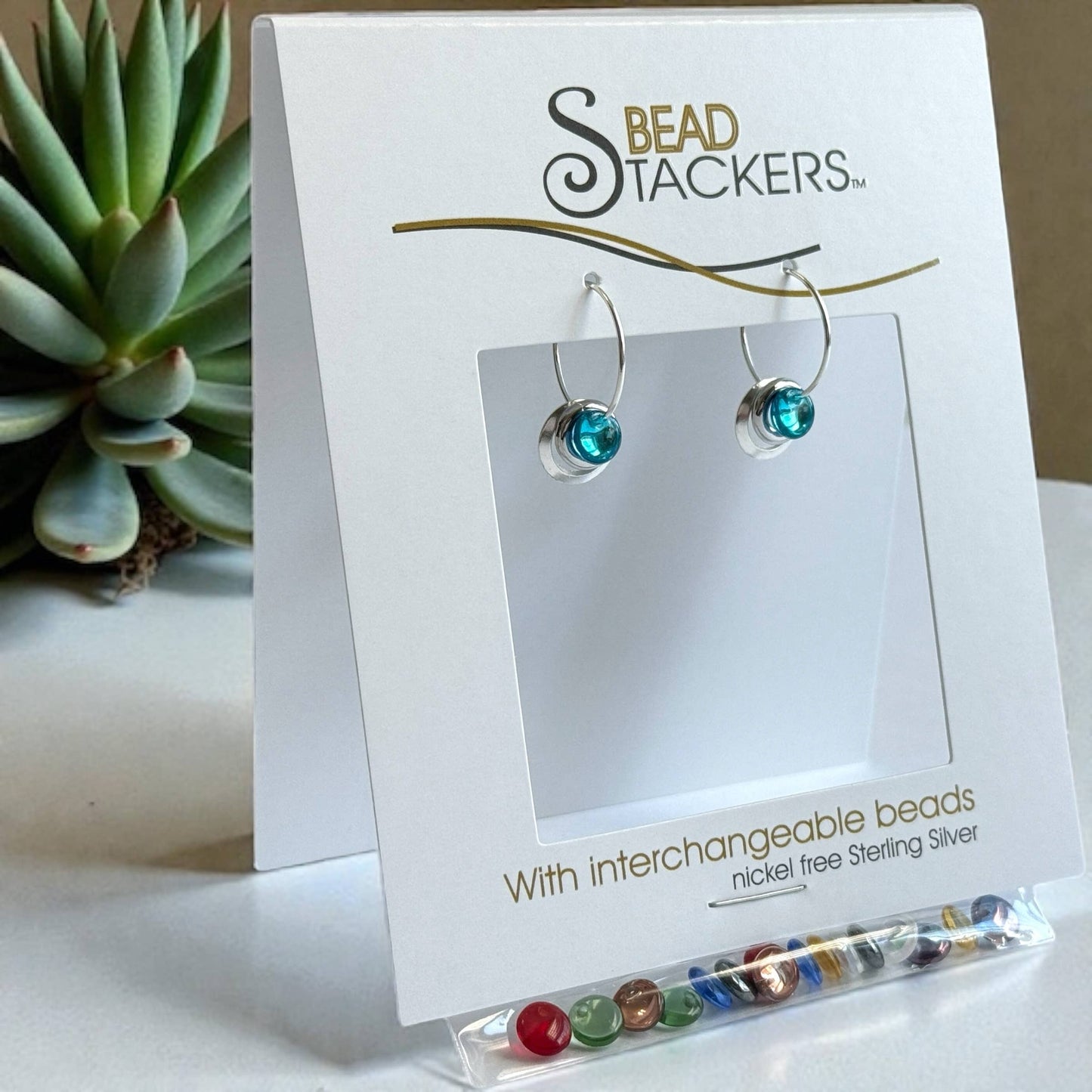 0024 - Mini earrings come with 9 interchangeable colours.