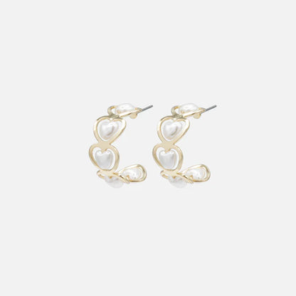 Gold half-circle earrings with heart-shaped pearls