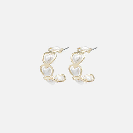 Gold half-circle earrings with heart-shaped pearls