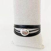 Single Multi-Strand Bracelet with Metallic Centerpiece