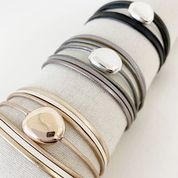 Single Multi-Strand Bracelet with Metallic Centerpiece