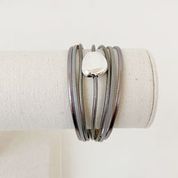 Single Multi-Strand Bracelet with Metallic Centerpiece