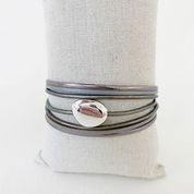 Single Multi-Strand Bracelet with Metallic Centerpiece