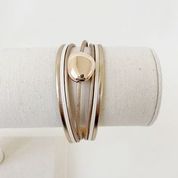 Single Multi-Strand Bracelet with Metallic Centerpiece